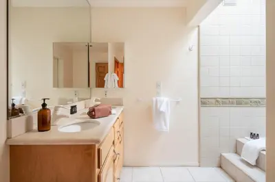 a bathroom with a sink and a shower at Hartwood by AvantStay Cozy Big Bear Abode w Spacious Deck Stone Fireplace in Big Bear Lake