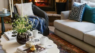 a living room with a couch and a coffee table at Hartwood by AvantStay Cozy Big Bear Abode w Spacious Deck Stone Fireplace in Big Bear Lake