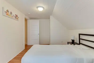 a bedroom with a white bed and a white ceiling at 5 Bedroom Koreatown Charmer near DTLA in Los Angeles