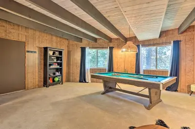 a large room with a pool table in it at Lake Arrowhead Cabin with Mid-Century Charm! in Lake Arrowhead