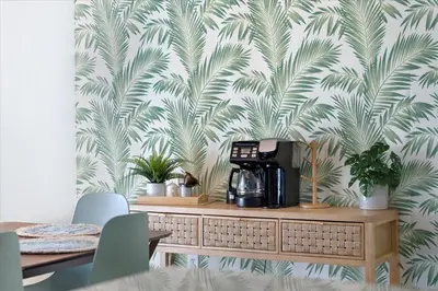 a coffee maker on top of a table with a wallpaper at Revitalizing 3 Bedroom Home With Pool, Pet-Friendly, Wi-fi in Bakersfield