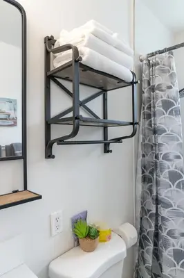 a bathroom with a towel rack above a toilet at Bright & Cozy Getaway-10min to Downtown LA in Alhambra