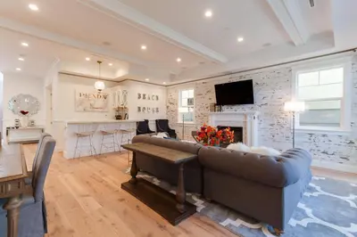 a living room with a couch and a fireplace at Beautiful 2 Story Right by the Water, Ocean View in Long Beach