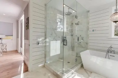 a bathroom with a shower with a tub and a sink at Beautiful 2 Story Right by the Water, Ocean View in Long Beach