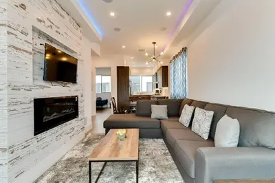a living room with a couch and a fireplace at Luxury Modern 4 bedroom 3 Bath Home With Rooftop Deck #3 in Los Angeles