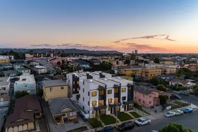 an aerial view of a city at sunset at 2 Luxury Modern 8 Bedroom Home with Rooftop Decks in Los Angeles