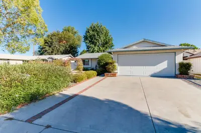 a house with a driveway with a garage at 4 Bedroom West Hills Charmer with Pool and Jacuzzi in Los Angeles