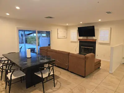 a living room with a couch and a table at 4 Bedroom West Hills Charmer with Pool and Jacuzzi in Los Angeles