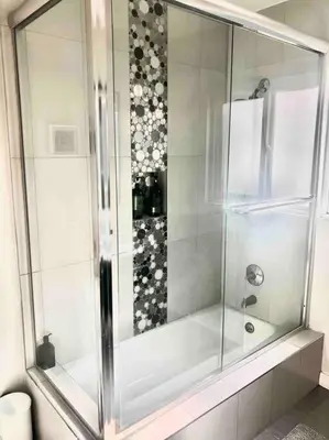 a shower with a glass door in a bathroom at Luxury house pool & Spa 10 mins from Hollywood & Universal Studios in Los Angeles