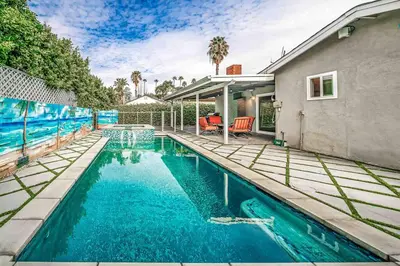 a swimming pool in the backyard of a house at Luxury house pool & Spa 10 mins from Hollywood & Universal Studios in Los Angeles