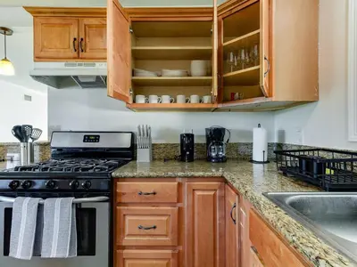 a kitchen with a stove and a sink at 5 Bedroom Charmer in Granada Hills in Granada Hills