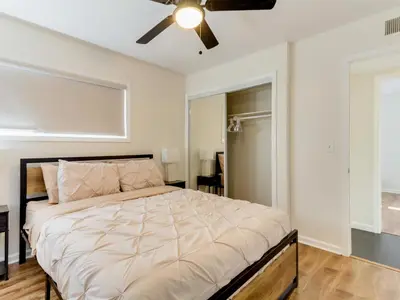 a bedroom with a bed and a ceiling fan at 5 Bedroom Charmer in Granada Hills in Granada Hills