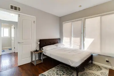 a bedroom with a bed and a window at Valley Modern Glam Charmer in Reseda