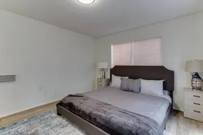 a bedroom with a large bed in a white room at New 4 bedroom Modern Villa in Mar Vista in Los Angeles