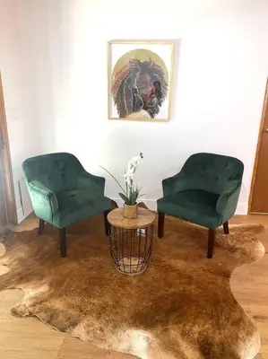 two green chairs and a table in a room at 4 Bedroom house large pool & spa in prime location in Los Angeles