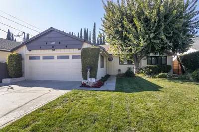 a house with a driveway and a garage at 4 Bedroom house large pool & spa in prime location in Los Angeles