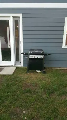 a grill is sitting outside of a house at Lake Balboa Modern 4 Bedroom 3 Bath Glam Charmer in Raymer