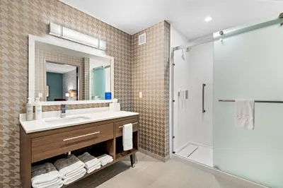 a bathroom with a sink and a shower at Home2 Suites By Hilton San Bernardino in San Bernardino