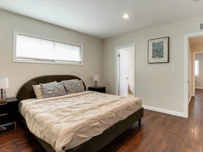 a bedroom with a large bed and a window at Woodland Hills Zen Modern in Woodland Hills