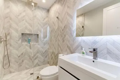 a bathroom with a sink and a toilet and a mirror at Luxury Modern 4 Bedroom 3 Bathroom Home with Rooftop Deck #1 in Los Angeles