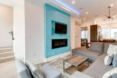 a living room with a couch and a fireplace at Luxury Modern 4 Bedroom 3 Bathroom Home with Rooftop Deck #1 in Los Angeles