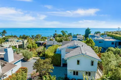 an aerial view of a house with the ocean in the background at Golden Getaway in Summerland