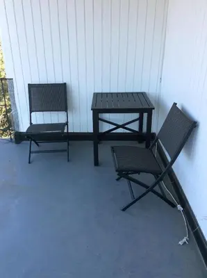 a picnic table and a chair on a patio at 5 bedroom 3 bath home near universal in Sherman Oaks