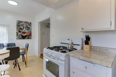 a kitchen with a white stove top oven in a room at 2 Bedroom Mid-Wilshire Charmer close to Downtown in Los Angeles
