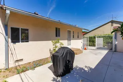 a black object sitting outside of a house at 2 Bedroom Mid-Wilshire Charmer close to Downtown in Los Angeles