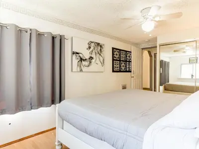 a bedroom with a bed and a ceiling fan at 3 bedroom Mid-Wilshire Charmer near Downtown in Los Angeles