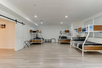 a room with three bunk beds and a hallway at Large 5 bedroom charmer wIth pool in Los Angeles