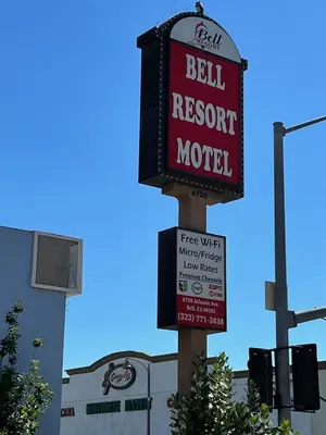 a sign for a bell resort motel on a street at BELL RESORT MOTEL in Bell