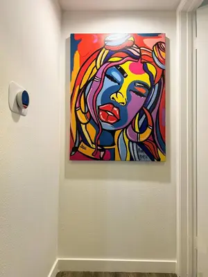 a painting of a woman on a wall at Hollywood Purple Habitat in Los Angeles