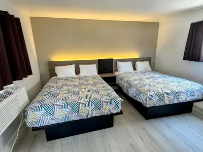 a room with two beds in a room at Keystone Motel in Norwalk