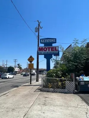 a motel sign on the side of a street at Keystone Motel in Norwalk