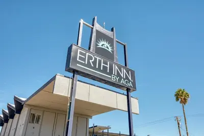 a sign for the entrance of a building at ERTH INN by AGA- Mojave in Mojave