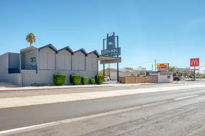 an empty street in front of a gas station at ERTH INN by AGA- Mojave in Mojave
