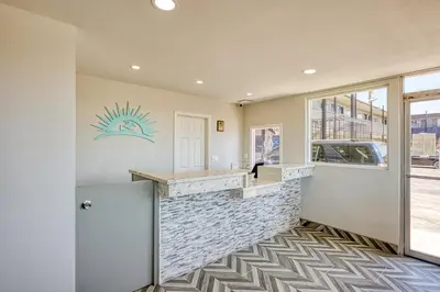 a lobby with a bar with a stone counter at ERTH INN by AGA- Mojave in Mojave