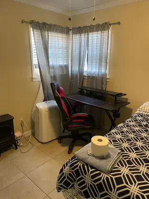 a bedroom with a desk and a bed and a desk at Sky Fresh Home Stay in Apple Valley
