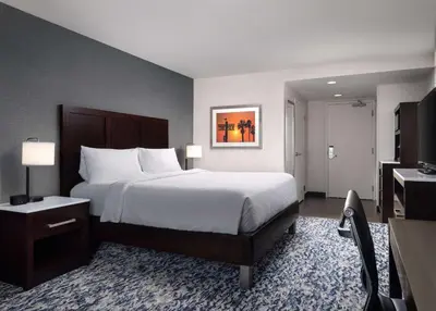 a hotel room with a bed and a television at Hilton Garden Inn Los Angeles/Redondo Beach in Redondo Beach