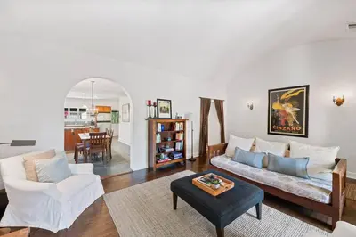 a living room with a couch and a table at Secluded 4BR Spanish Oasis in the Heart of LA in Los Angeles