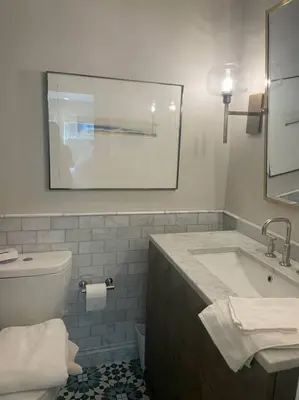 a bathroom with a sink and a toilet and a mirror at The Best Santa Monica Beach Area, Any days,Newly Remodeled in Los Angeles