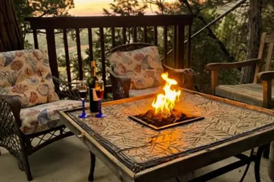 a fire pit on a table on a patio at Lakeside Serenity in Crestline
