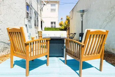 two chairs and a table on a patio at Charming LA 2 Bedroom For Your Home Away From Home in Los Angeles