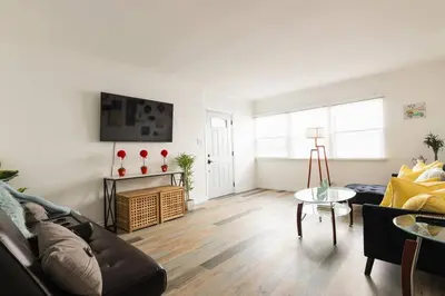 a living room with a couch and a table at Charming LA 2 Bedroom For Your Home Away From Home in Los Angeles
