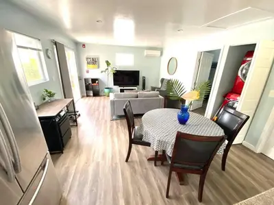 a living room with a table and a couch at Hidden Gem LA 2bd house with dreamy backyard in Encino