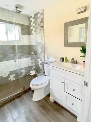 a bathroom with a toilet and a sink and a shower at Hidden Gem LA 2bd house with dreamy backyard in Encino