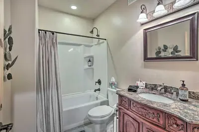 a bathroom with a toilet and a sink and a shower at The Zen Playhouse with Lake Arrowhead Access! in Lake Arrowhead