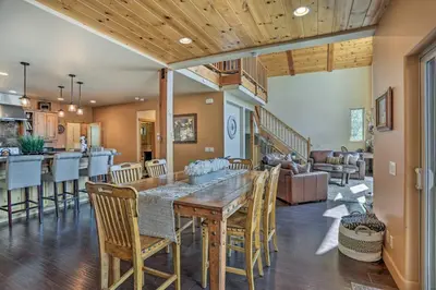 a dining room and kitchen with a table and chairs at The Zen Playhouse with Lake Arrowhead Access! in Lake Arrowhead