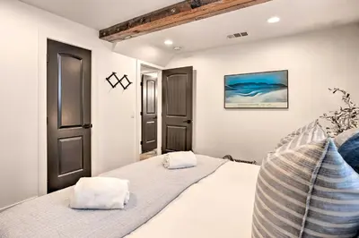 a bedroom with a bed with two pillows on it at Luxe Timberland Villa with Lake Arrowhead Access! in Lake Arrowhead